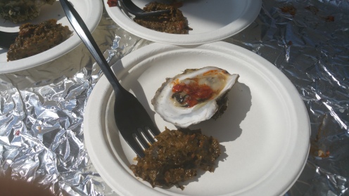 PIERRE THIAM CATERING Grilled Island Creek Oysters Smoked Crayfish Mignonette and Cassava Leaves with Paenuts